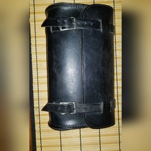 Black leather bag 9.5Lx5.5Hx3.5W & 2 straps 22" long with 8 adjustment holes.